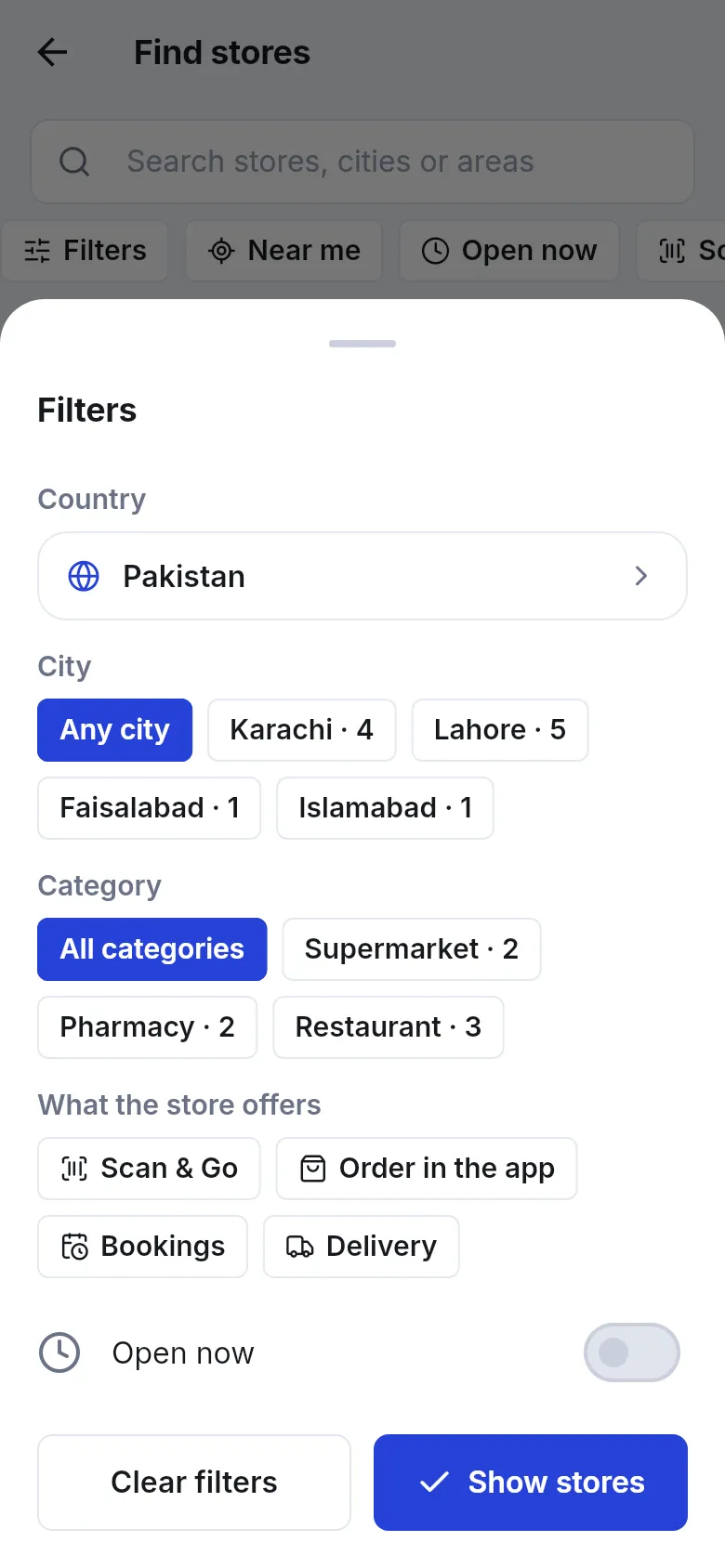Filters sheet with Country, City chips, Category chips, What the store offers chips and an Open now switch, with Clear filters and Show stores buttons