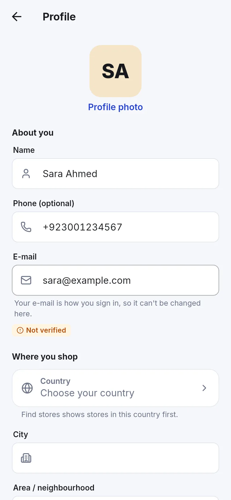 Profile screen where the e-mail shows a Not verified badge and Country says Choose your country